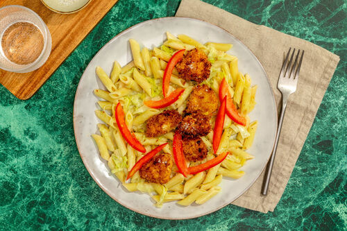 Hähnchennuggets mit Pasta in würziger, milchfreier Lauchsauce